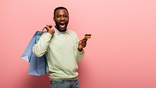 stock-photo-amazed-african-american-man-holding.jpeg