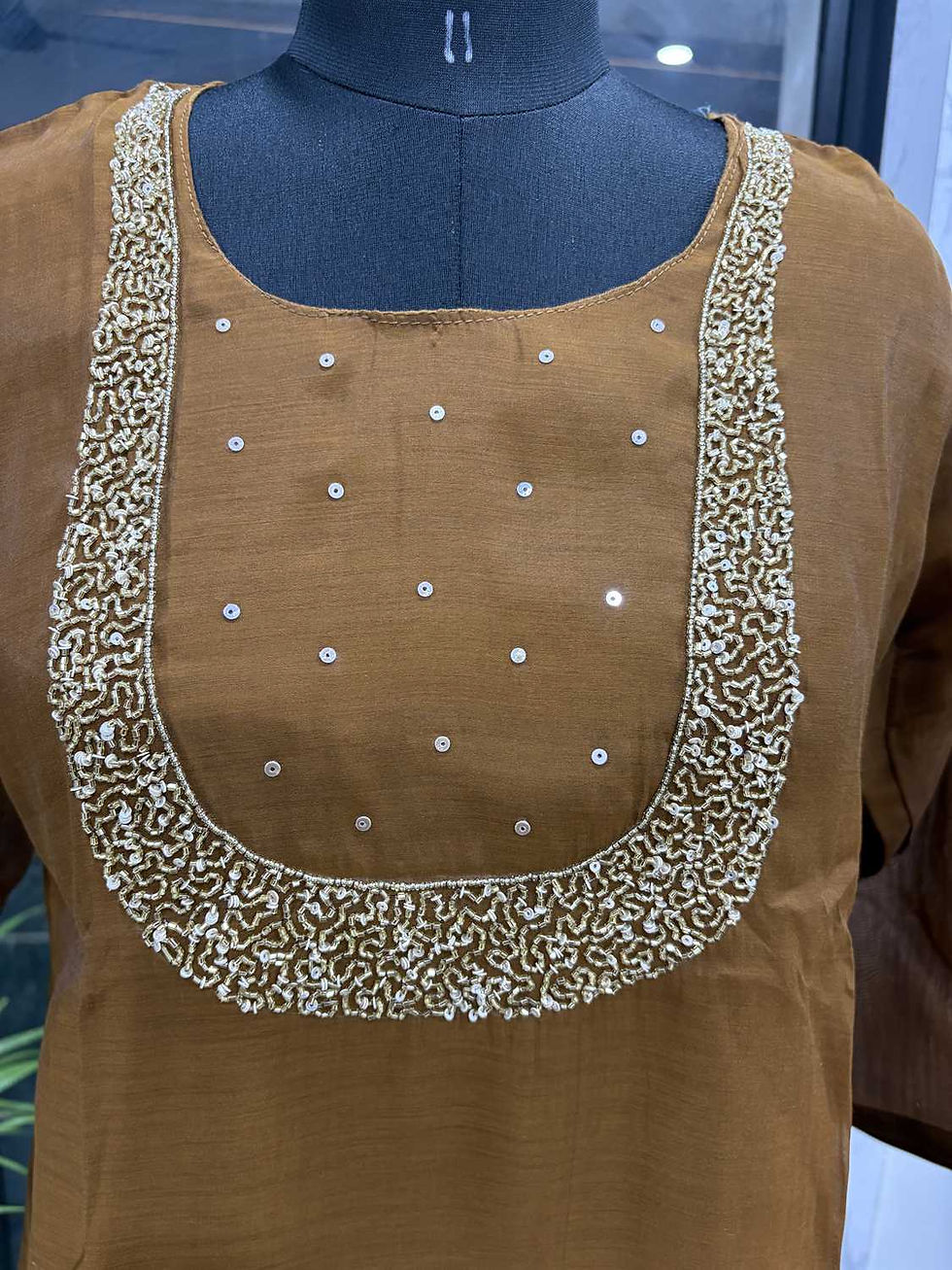 Thumbnail: Brown Mul Chandheri silk suit set with handwork on the yoke