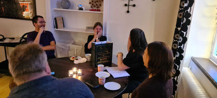 people laughing at a coffee table