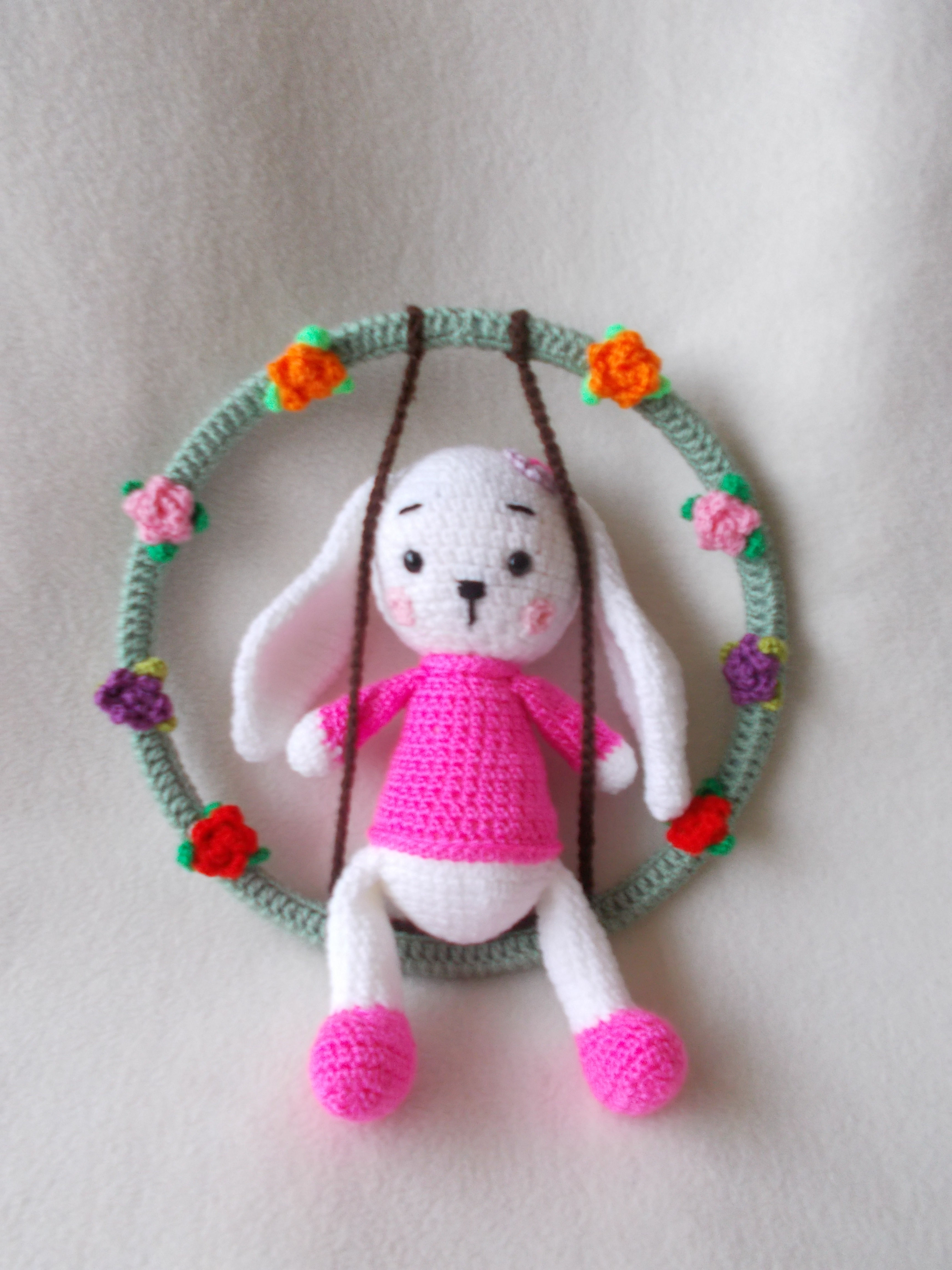 Crochet bunny on a swing