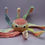 Thumbnail: Crochet  soft toy octopus. In a pink mixed and white yarn.