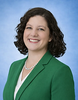Professional portrait with green blazer.png