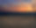 candles heart at sandy sea beach against bright sunset - romantic card concept.jpg