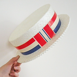 Photo of political straw hat held in the air