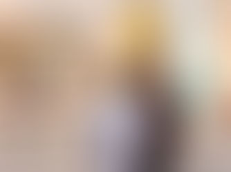 two men looking at art on a wall