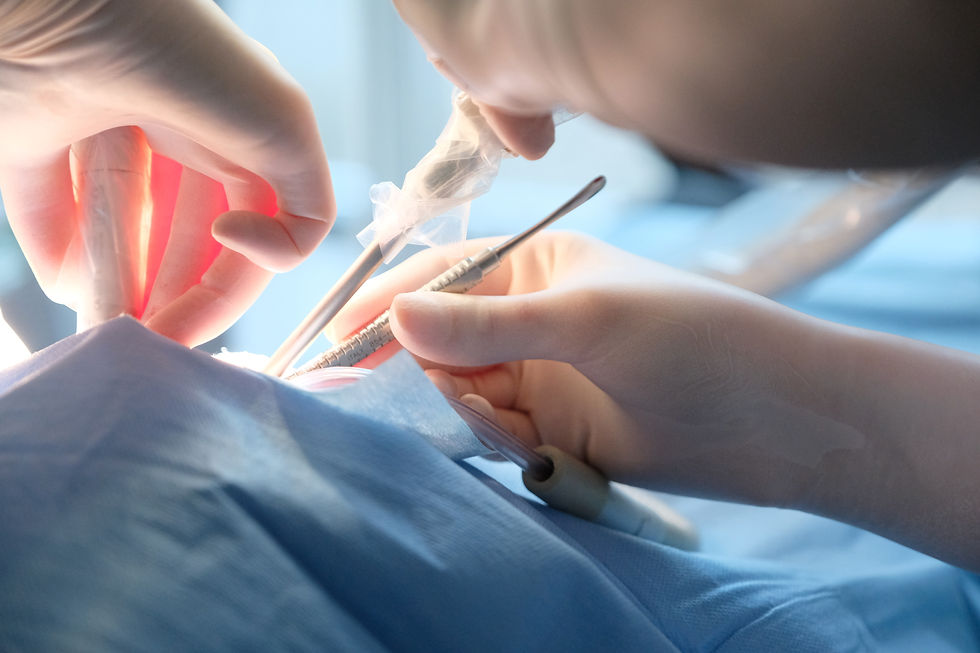 A close up of a surgeons hands and tools while performing a surgery