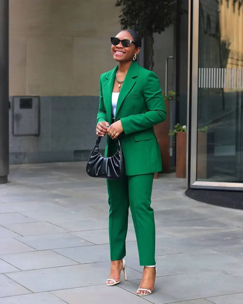 woman wearing an emeral green suit
