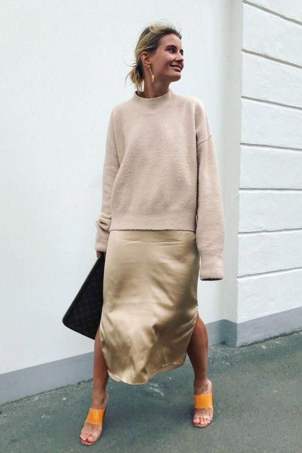 Woman wearing sand and metallic outfit