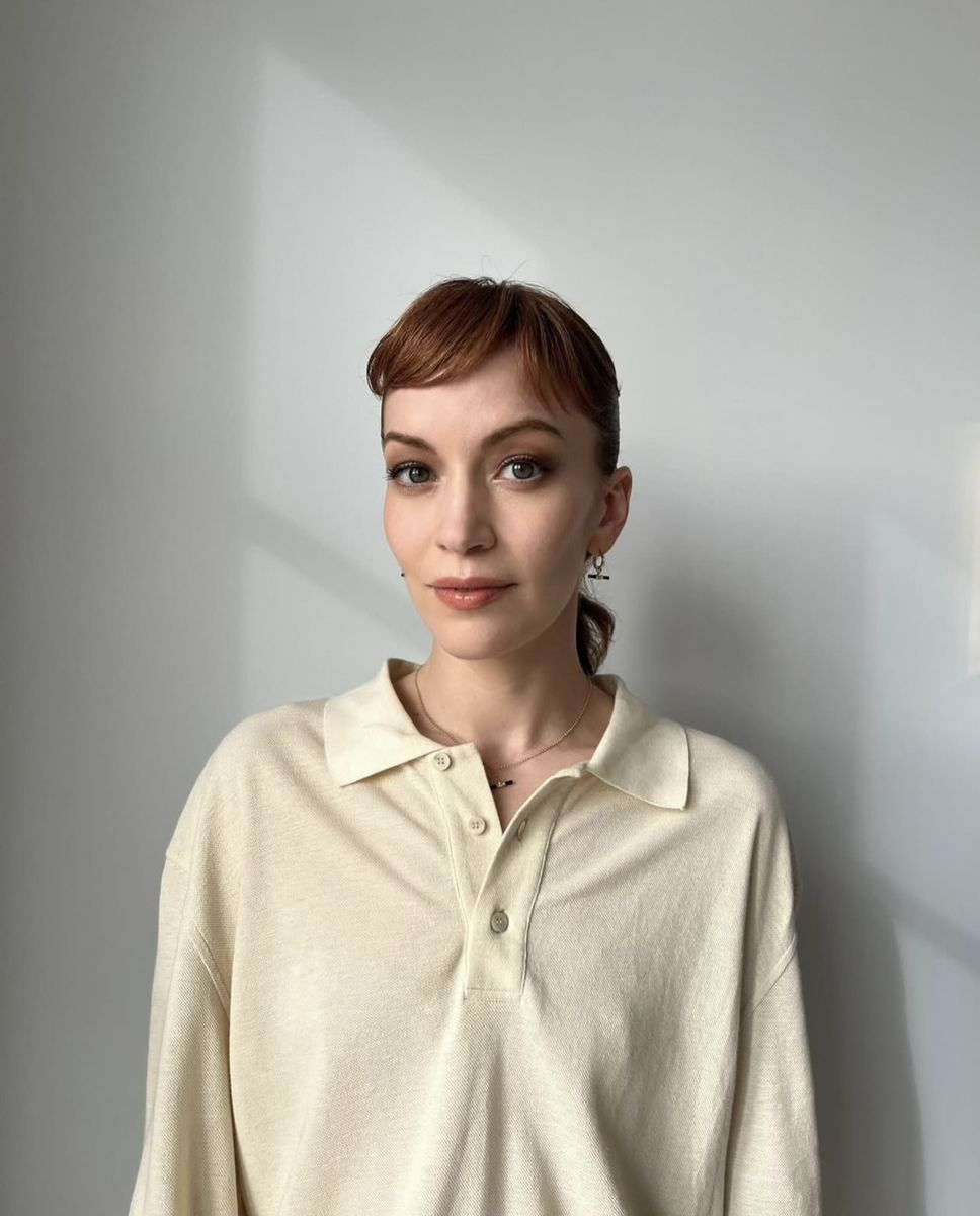 Britt Lower posing to camera