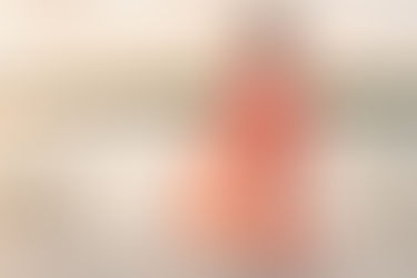 woman in a coral dress