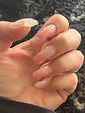 Take a look at my latest masterpiece! These poly gel nails took a lot of time and effort to create, but I have to say, I think they came out pretty darn good. Each nail is perfectly sculpted with just the right amount of product, and the polish is flawless with zero bumps or lumps. You can see the shine and texture of the nails up close - it's incredible how this DIY kit can create salon-quality nails at home!