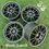 الصورة المصغرة: Four gray wheels Wheels B. and. B OZ ULTRALEGGERA on a green surface.