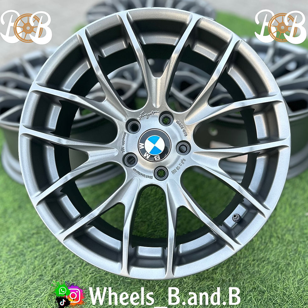BMW wheel design, Wheels B.and.B text with logo displayed on green grass wheels B and B