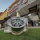 Thumbnail: Shiny silver wheel in front of Ain Al Saqr store with background wheels.