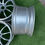 Thumbnail: Silver car wheels rim, wheels B and B, placed on green grass.