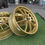 Thumbnail: Gold WORK GNOSIS CV1N wheels are displayed on a green surface, wheels B and B.