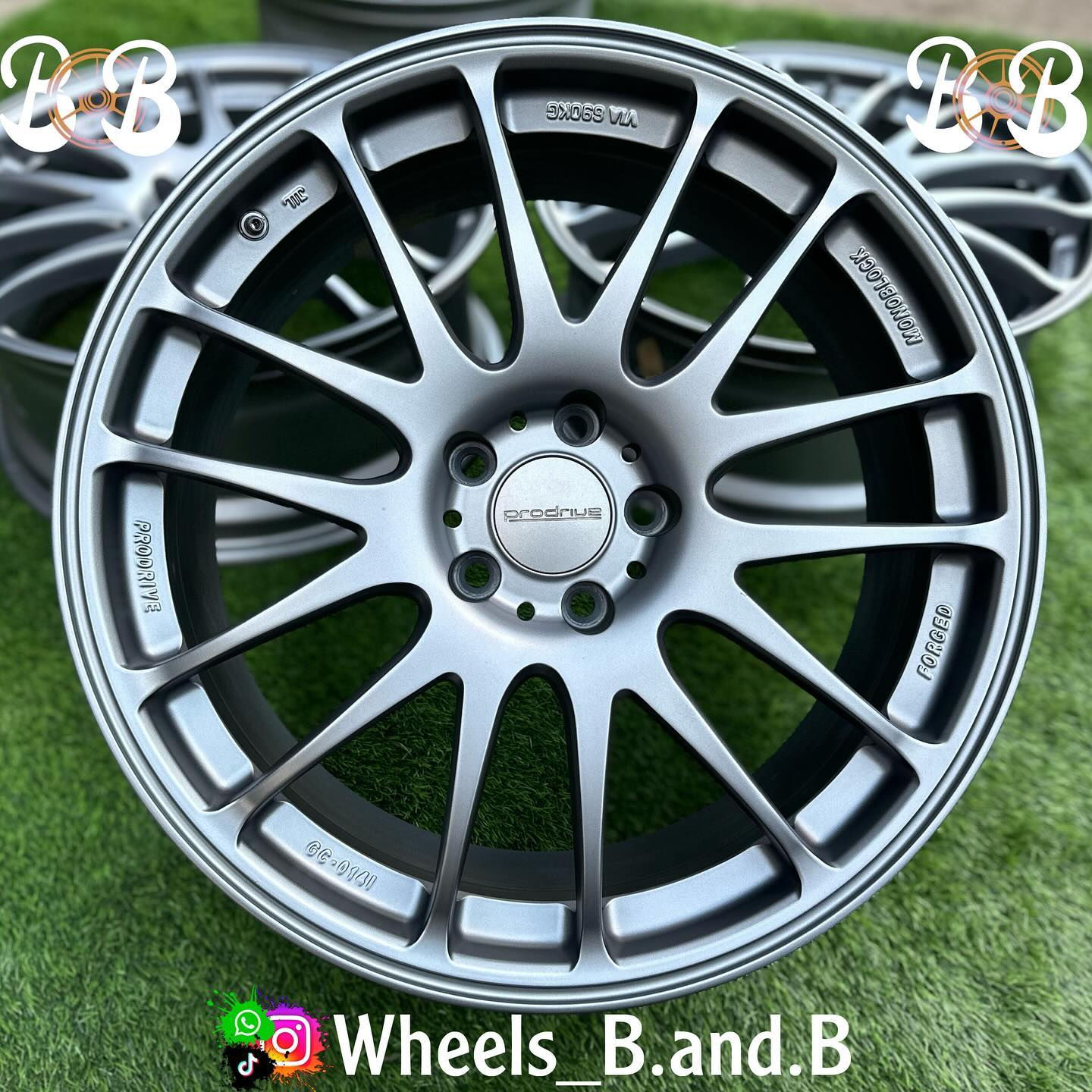 Close-up of a silver wheel with visible text, RAYS GT-C, wheels B and B.