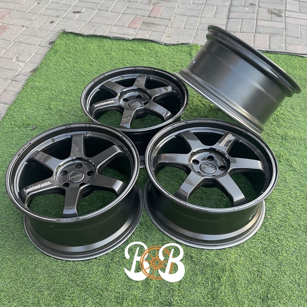 الصورة المصغرة: Four dark wheels on green grass, BB logo, ADVAN RACING RS2R, wheels B and B.