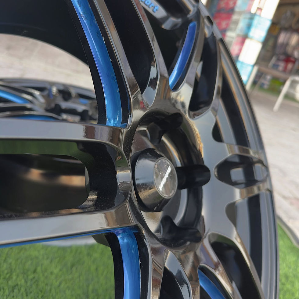Thumbnail: Close-up of chrome wheels with blue accents and black details. wheels B and B