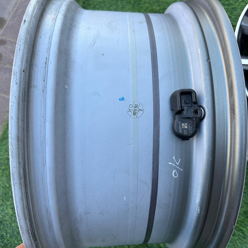 الصورة المصغرة: Silver car wheel with sensor and visible text, wheels B and B