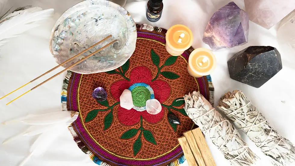 Sacred altar featuring palo santo, white sage and crystals.
