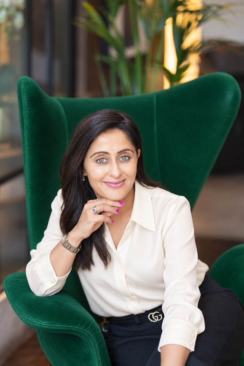 hemina on green chair.png
