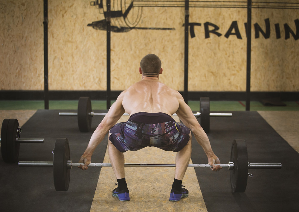 A CrossFit training about to perform a snatch as part of a barbell only workout.