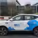 A BluSmart vehicle parked on the road 