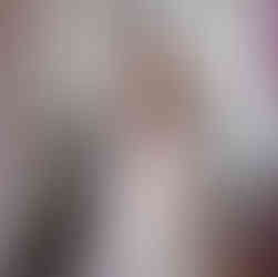 African bride standing near window in church.