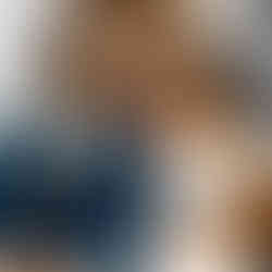 Bride and groom sitting together on stairs.