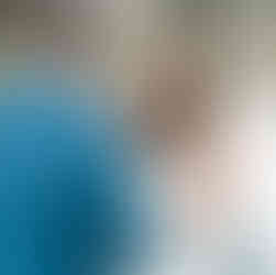 Bride smiling at groom during ceremony.