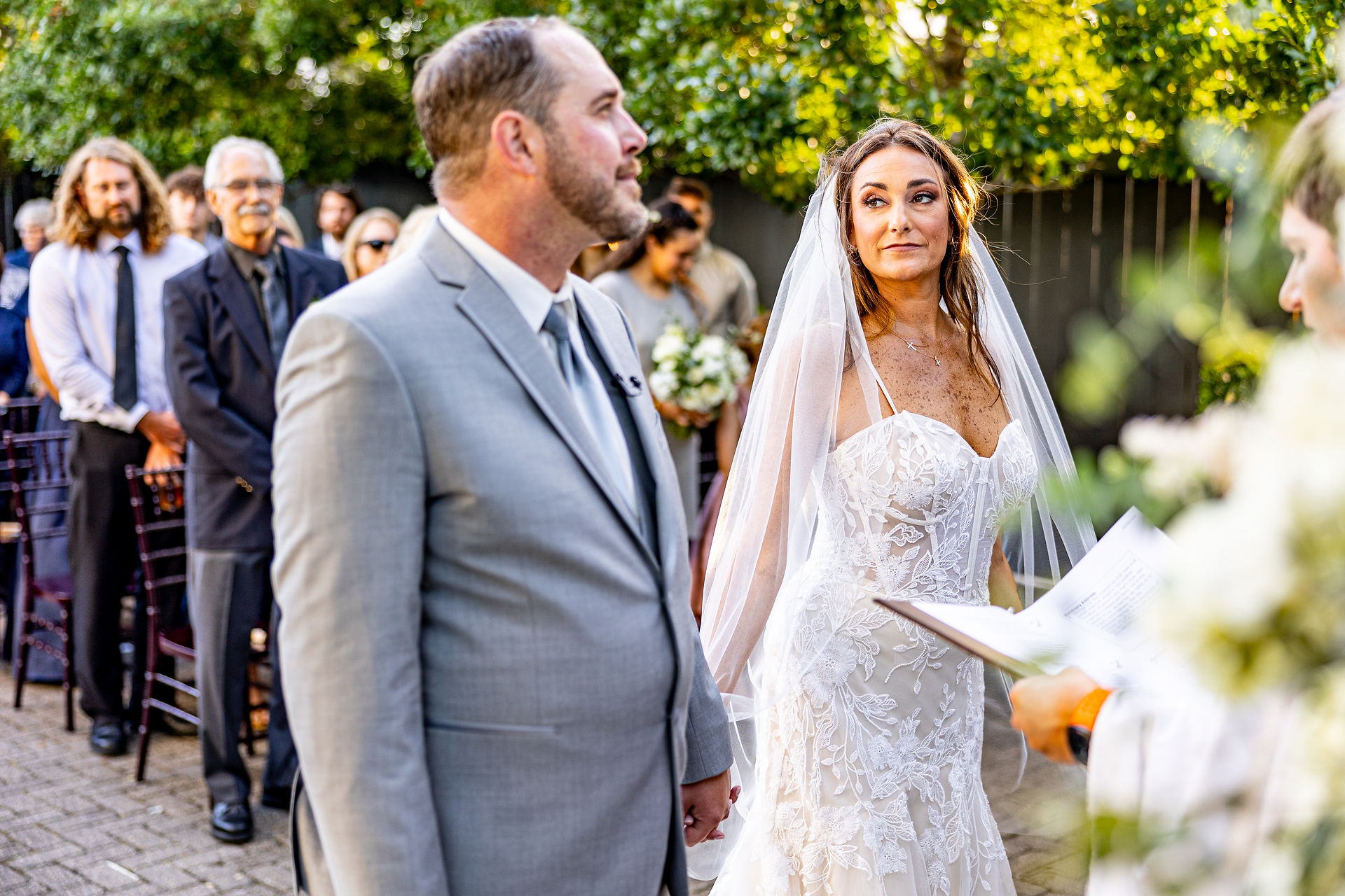 Bride and groom looking at each other during ceremony.