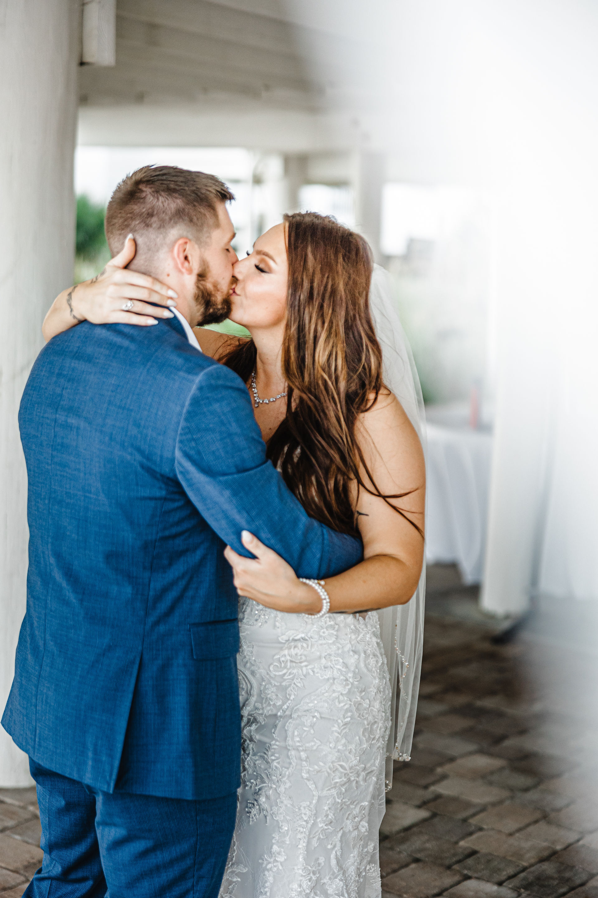 Bride and groom kissing.