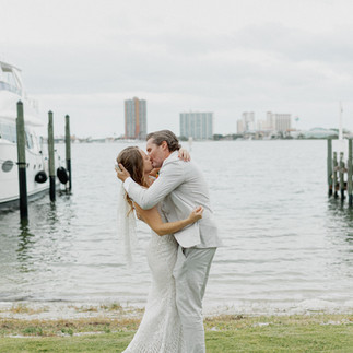 Bride and groom kissing during ceremony