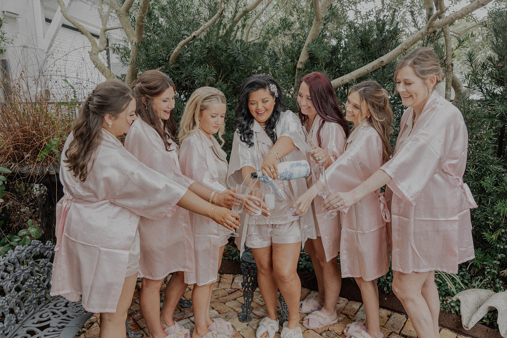 Bride and bridesmaids toasting