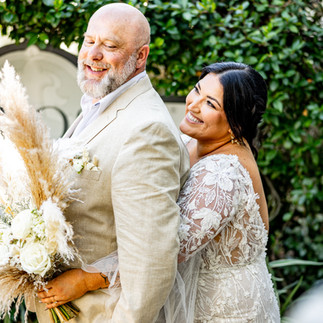 Bride cuddling with groom