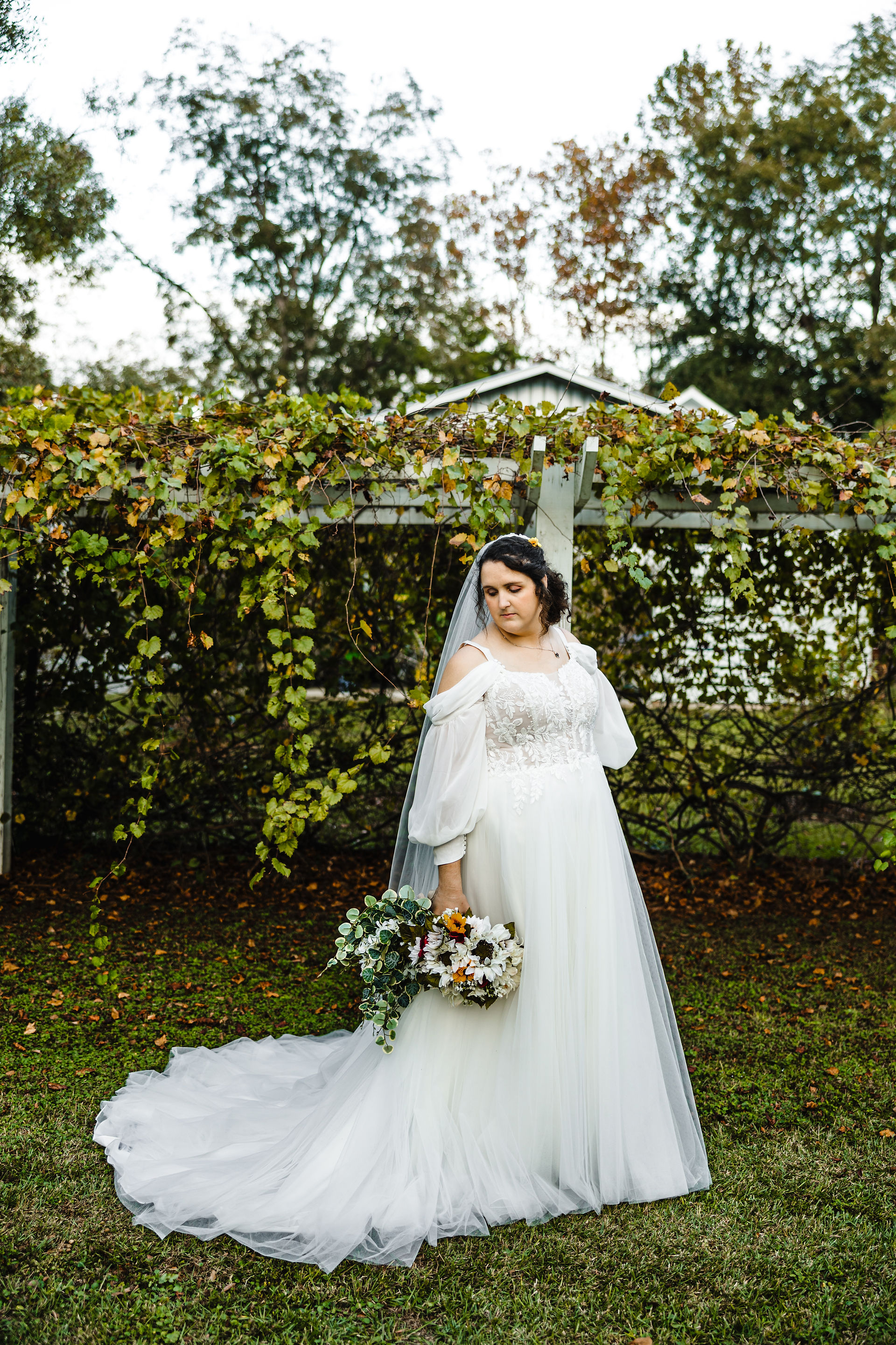 Bride holding flowers.