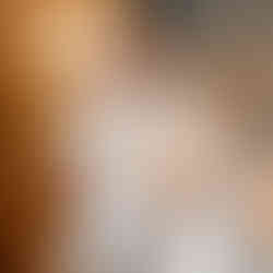 Groom laughing during reception