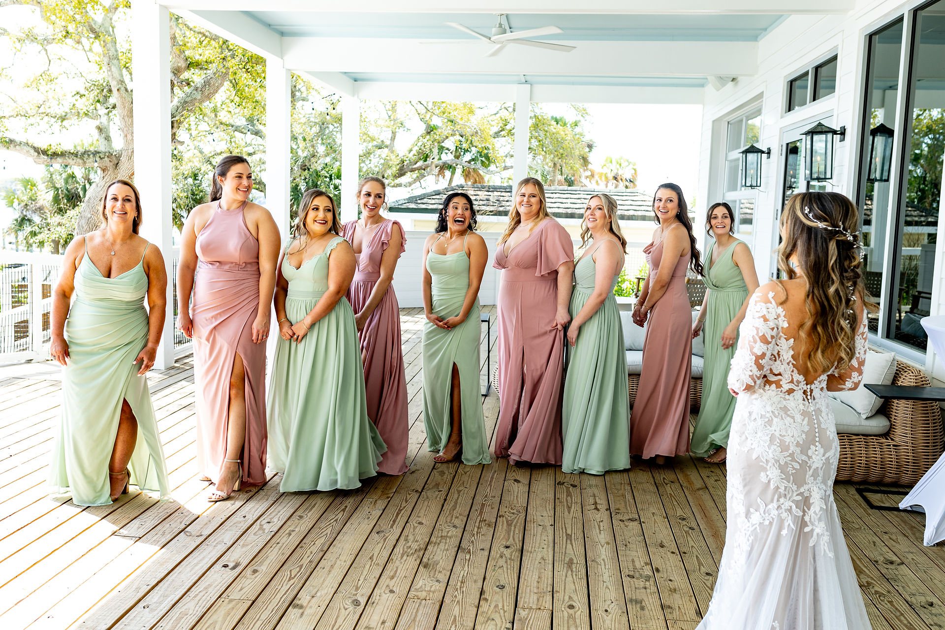 Bridesmaids turning around to see bride.