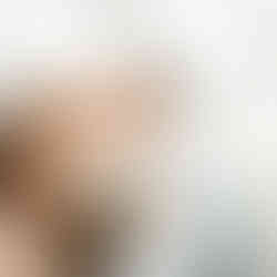 Bride and groom kissing under veil