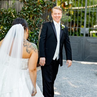 Groom seeing bride for the first time.