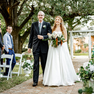 Bride and father walking down the aisle