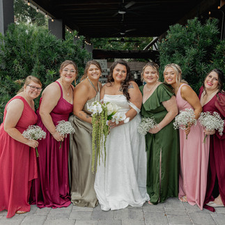 Bride posing with her bridesmaids
