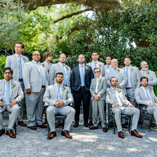 Groom posing with groomsmen.