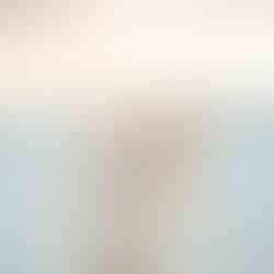 Bride and groom walking on the beach.