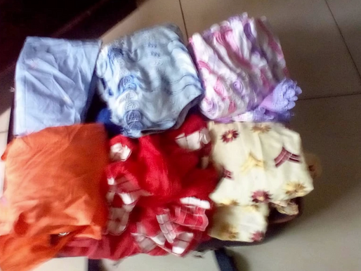 Ms Comfort Leopold donates rice & clothing items to Makondu women & girls 24/September/2018