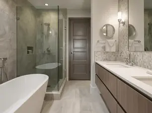 Newly renovated bathroom with bath tub and glass bath