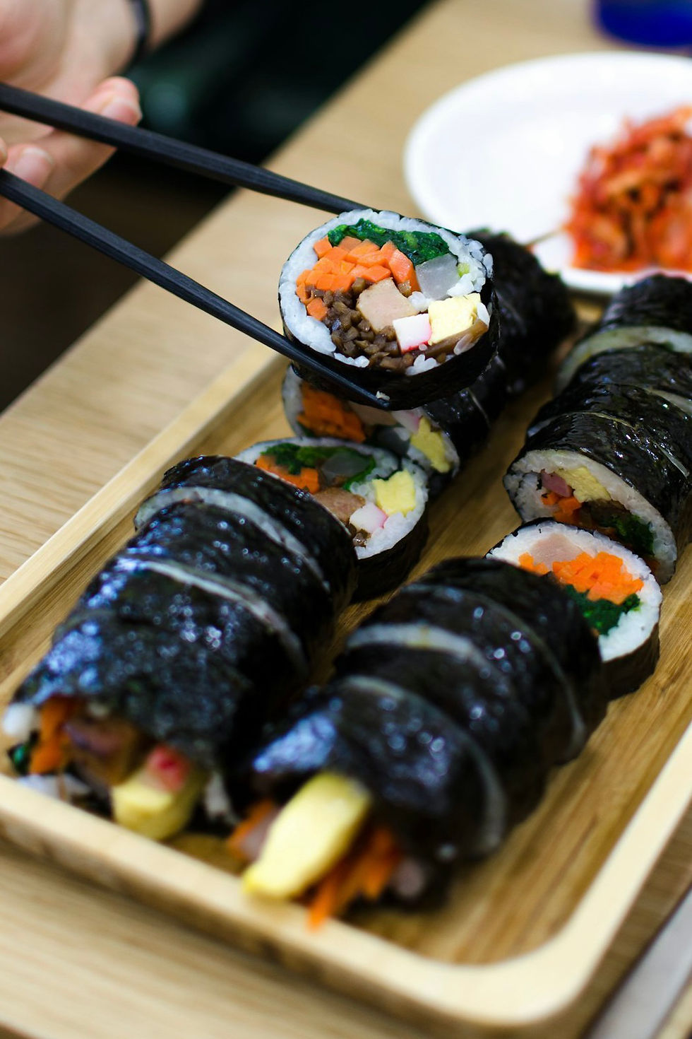 Close-up view of a delivery bag with Korean food containers ready for dispatch