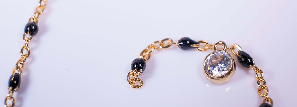 Gold beaded chain with CZ charm