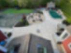 Aerial view of a patio with a fire pit and pool area.